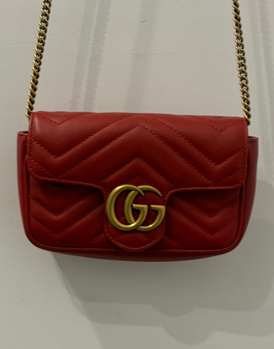 Gucci GG Marmont Super Mini Chain Shoulder Bag in Hibiscus Red Matelassé Leather with antique gold hardware